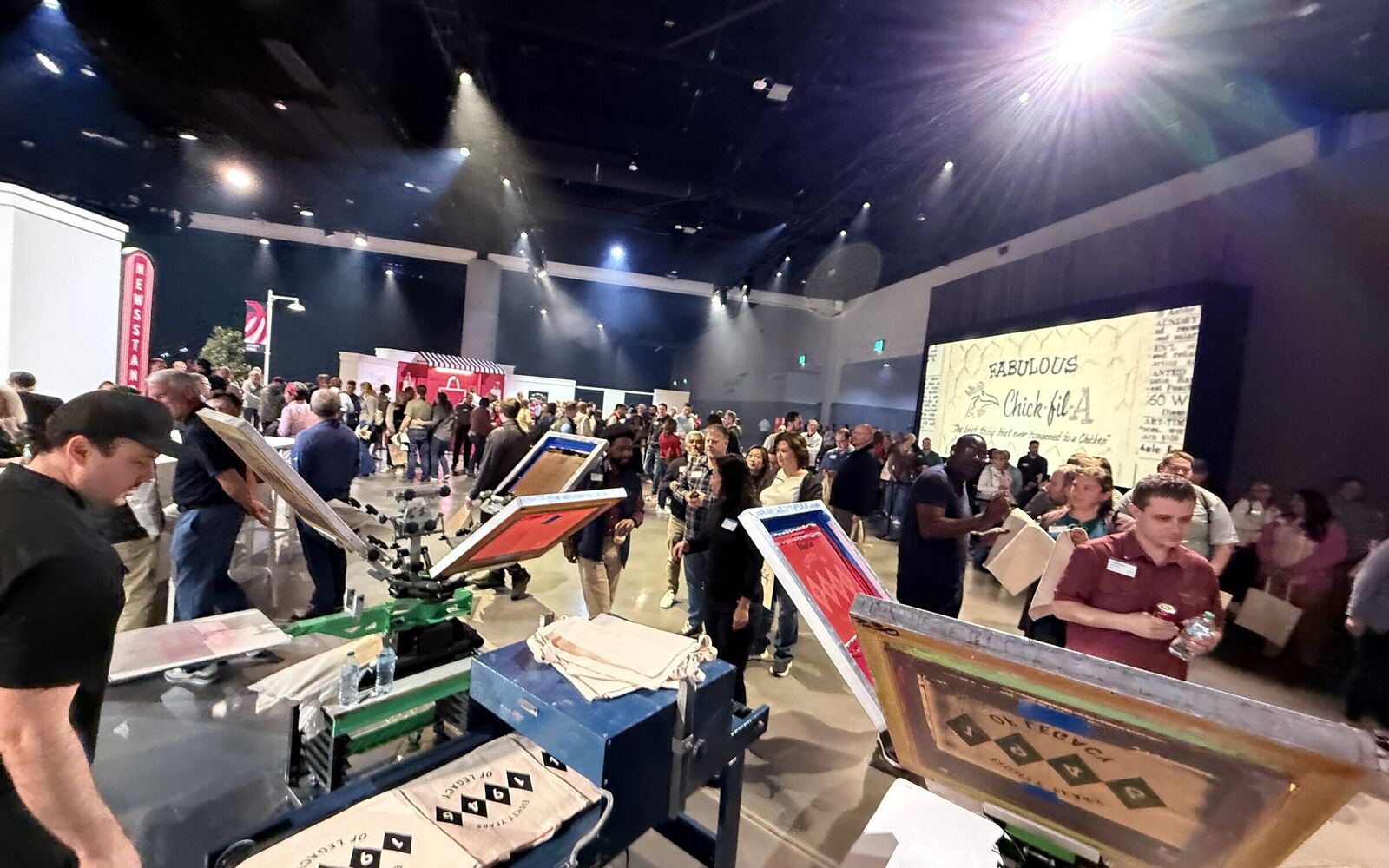Corporate branded t-shirt printing station at a company event